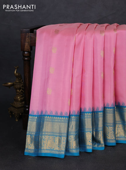 Pure gadwal silk saree light pink and cs blue with allover zari woven buttas and temple design zari woven border