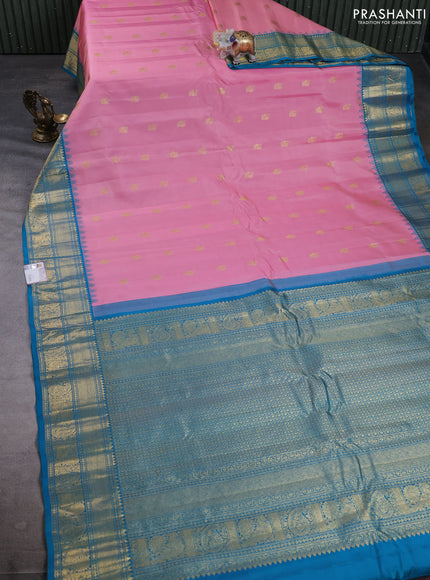 Pure gadwal silk saree light pink and cs blue with allover zari woven buttas and temple design zari woven border