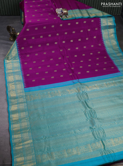 Pure gadwal silk saree magenta pink and teal blue with allover zari woven buttas and temple design zari woven border