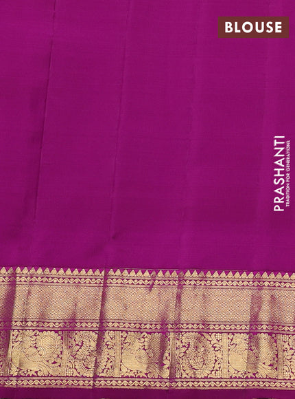Pure gadwal silk saree mild teal and magenta pink with allover zari woven buttas and temple design zari woven border