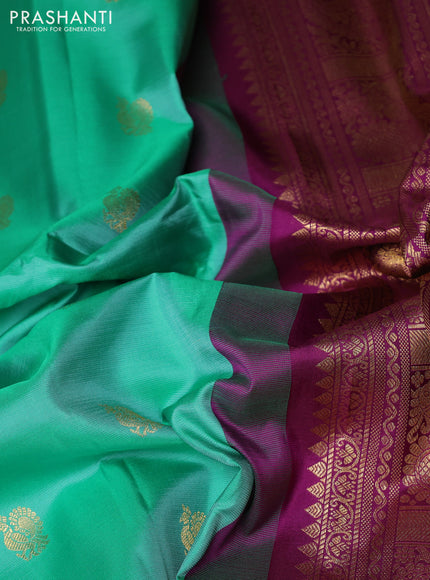 Pure gadwal silk saree teal green and purple with allover annam zari woven buttas and temple design zari woven border