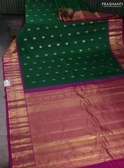 Pure gadwal silk saree green and pink with allover zari woven buttas and temple design zari woven border