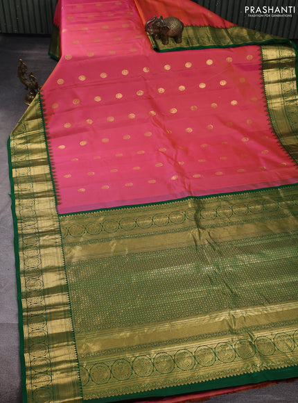Pure gadwal silk saree dual shade of pinkish yellow and green with allover zari woven buttas and temple design zari woven border