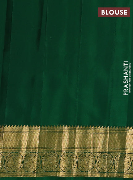 Pure gadwal silk saree dual shade of pinkish yellow and green with allover zari woven buttas and temple design zari woven border