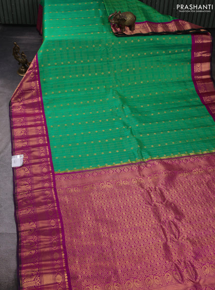 Pure gadwal silk saree light green and pink with allover zari checks & buttas and zari woven korvai border