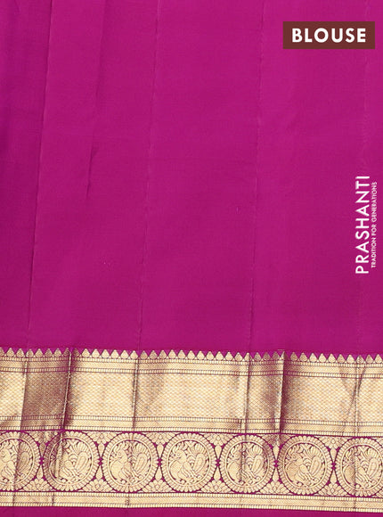 Pure gadwal silk saree dual shade of bluish green and pink with allover zarii woven buttas and temple design zari woven border