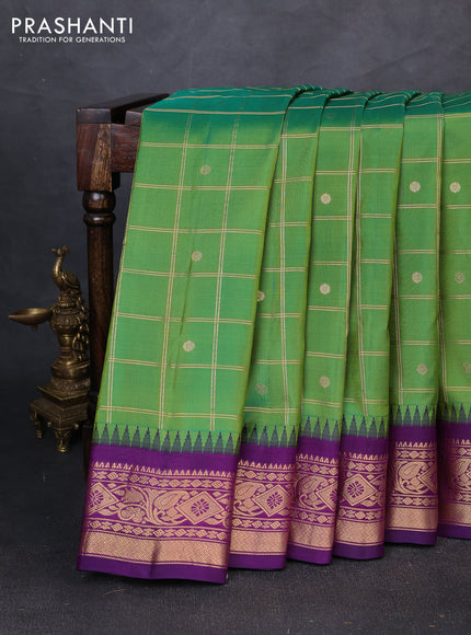 Pure gadwal silk saree green and purple with allover zari checks & buttas and temple design zari woven border