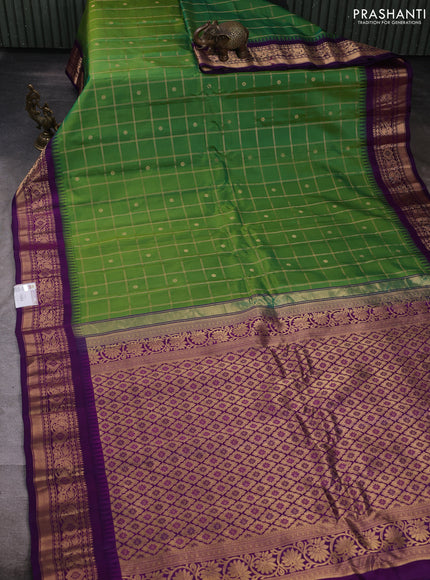 Pure gadwal silk saree green and purple with allover zari checks & buttas and temple design zari woven border