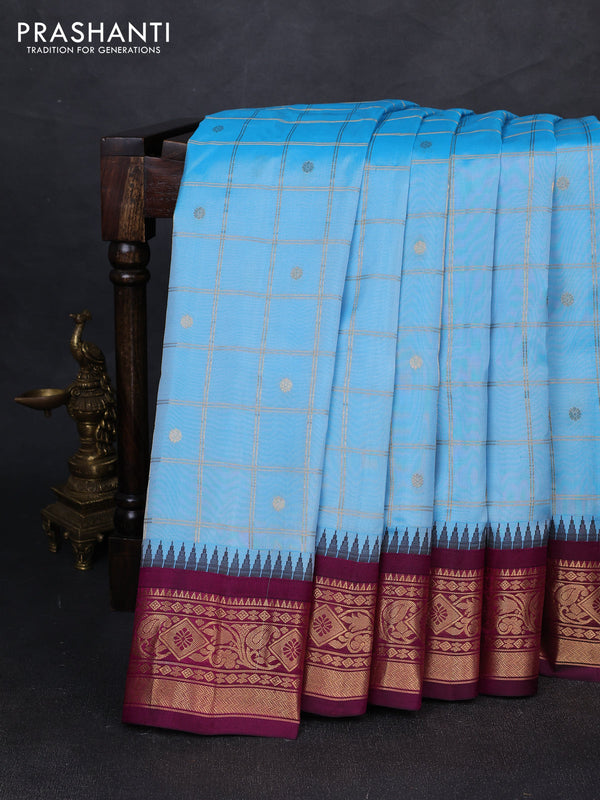 Pure gadwal silk saree blue and magenta pink with allover zari checks & buttas and temple design zari woven border