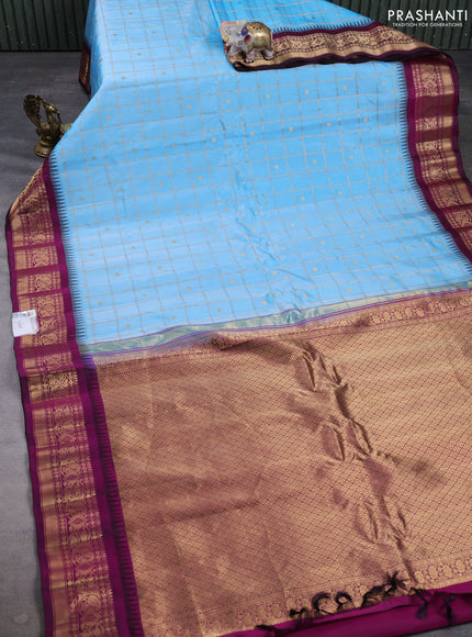 Pure gadwal silk saree blue and magenta pink with allover zari checks & buttas and temple design zari woven border