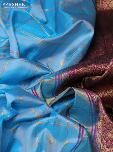 Pure gadwal silk saree blue and magenta pink with allover zari checks & buttas and temple design zari woven border