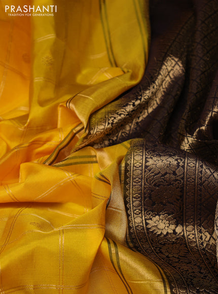 Pure gadwal silk saree yellow and coffee brown with allover zari checks & buttas and temple design zari woven border