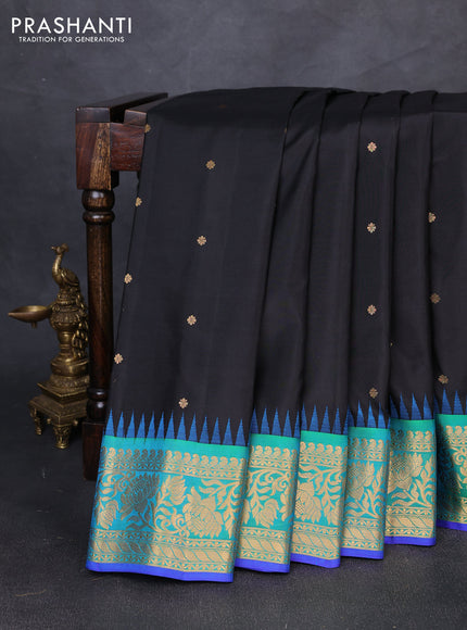Pure gadwal silk saree black and dual shade of bluish green with allover zari woven buttas and temple zari woven border
