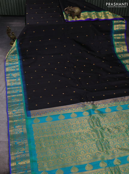 Pure gadwal silk saree black and dual shade of bluish green with allover zari woven buttas and temple zari woven border