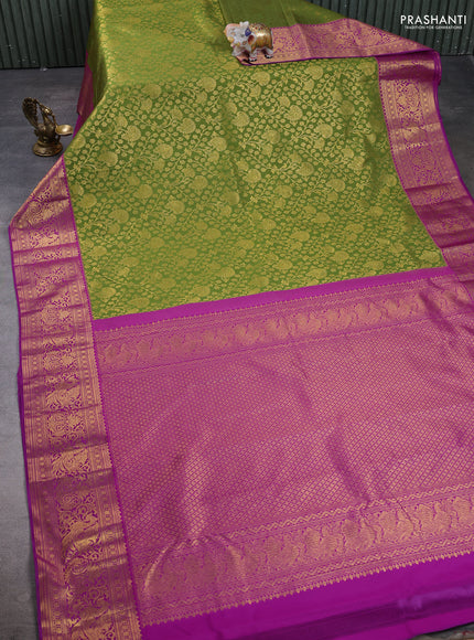 Kanchipuram silk saree light green and purple with allover zari woven brocade weaves and zari woven border