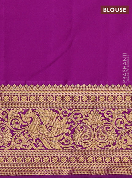 Kanchipuram silk saree light green and purple with allover zari woven brocade weaves and zari woven border