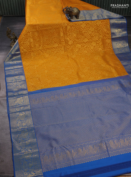 Kanchipuram silk saree mustard yellow and blue with allover zari woven brocade weaves and zari woven border