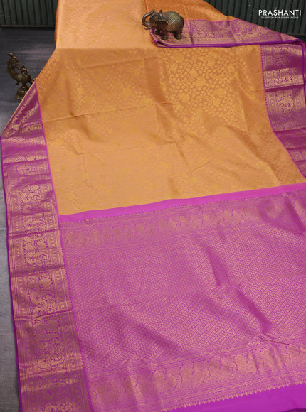 Kanchipuram silk saree pale orange and purple with allover zari woven brocade weaves and long zari woven border