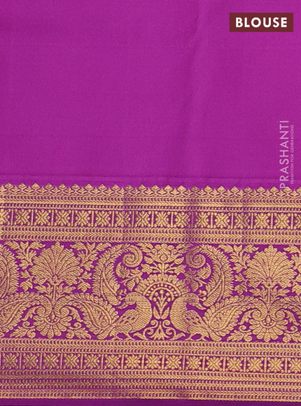 Kanchipuram silk saree pale orange and purple with allover zari woven brocade weaves and long zari woven border