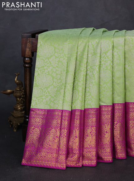 Kanchipuram silk saree light green and magenta pink with allover zari woven brocade weaves and long zari woven border