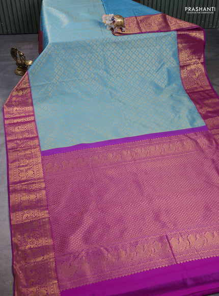 Kanchipuram silk saree blue and purple with allover zari woven brocade weaves and long zari woven border