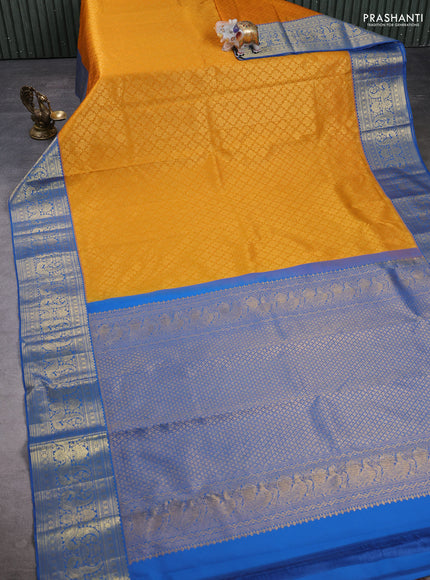 Kanchipuram silk saree mustard yellow and blue with allover zari woven brocade weaves and zari woven border