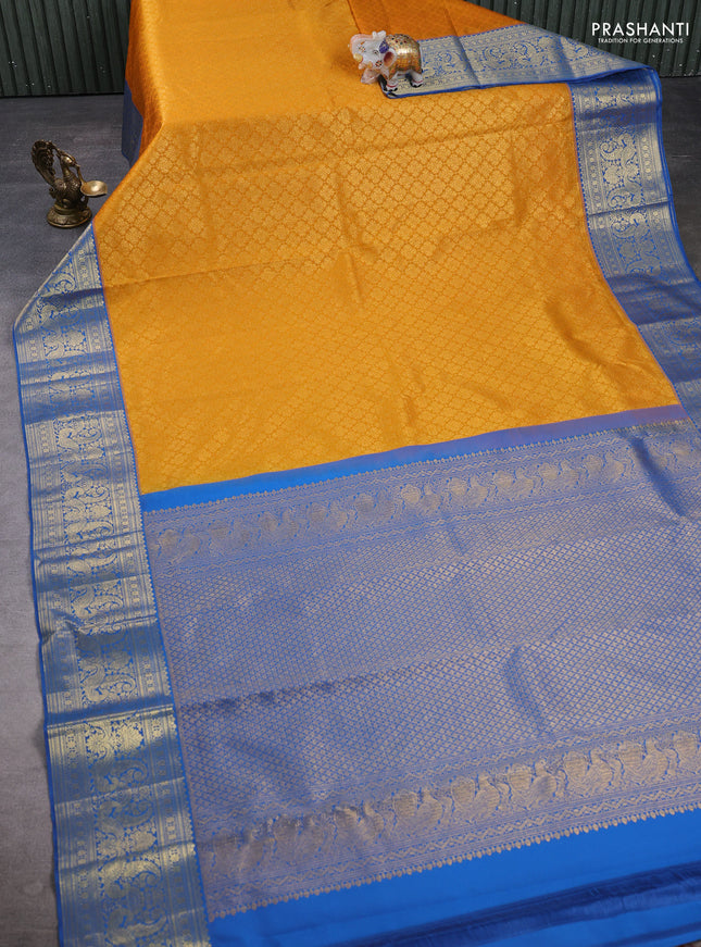 Kanchipuram silk saree mustard yellow and blue with allover zari woven brocade weaves and zari woven border