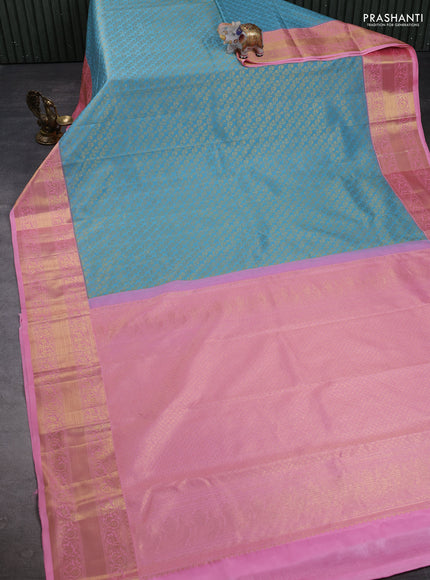 Kanchipuram silk saree light blue and light pink with allover zari woven brocade weaves and rich zari woven border