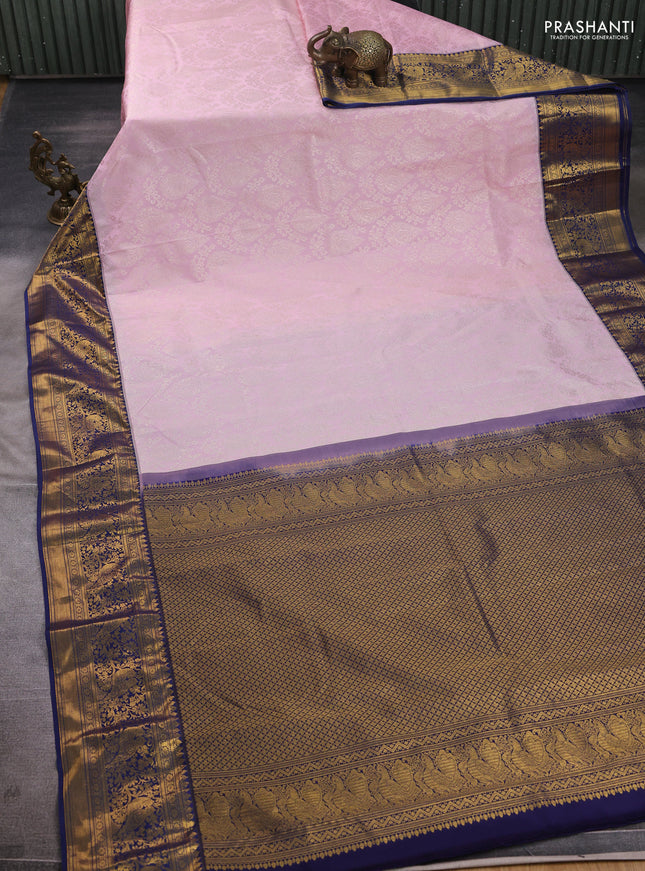 Kanchipuram silk saree light pink and navy blue with allover zari woven brocade weaves and zari woven border