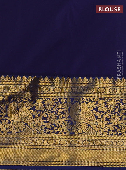 Kanchipuram silk saree light pink and navy blue with allover zari woven brocade weaves and zari woven border