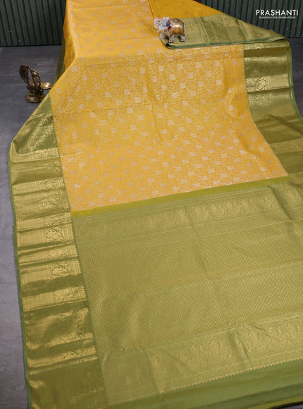Kanchipuram silk saree mustard yellow and green shade with allover zari woven brocade weaves and long zari woven border