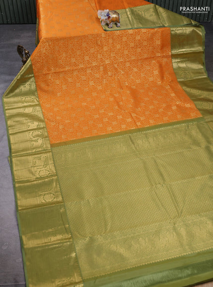 Kanchipuram silk saree dark mustard and green shade with allover zari woven brocade weaves and long zari woven border