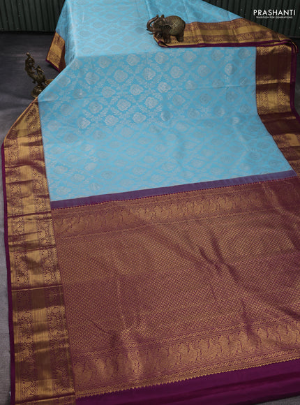 Kanchipuram silk saree light blue and purple with allover zari woven brocade weaves and rich zari woven border