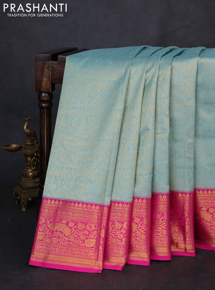 Kanchipuram silk saree teal blue and pink with allover zari woven brocade weaves and zari woven border