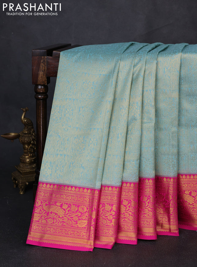 Kanchipuram silk saree teal blue and pink with allover zari woven brocade weaves and zari woven border