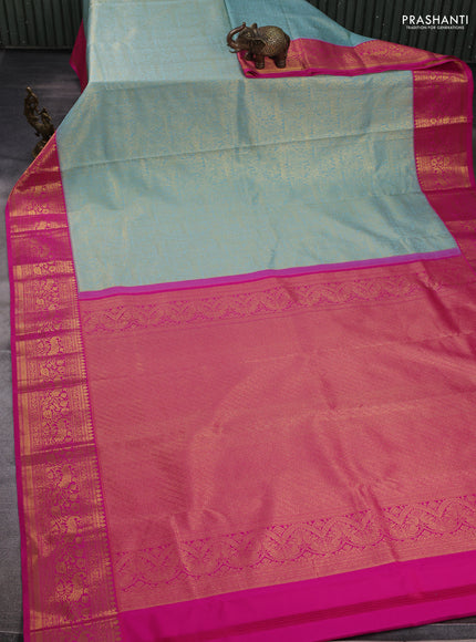 Kanchipuram silk saree teal blue and pink with allover zari woven brocade weaves and zari woven border