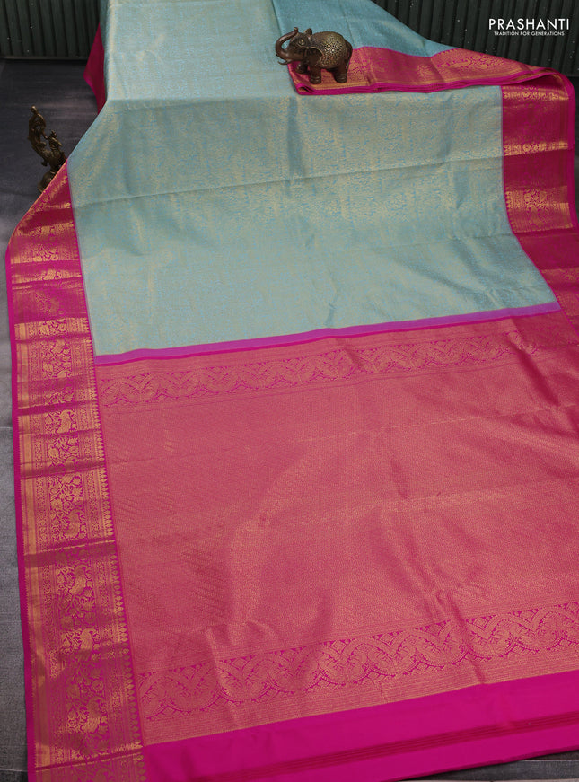Kanchipuram silk saree teal blue and pink with allover zari woven brocade weaves and zari woven border