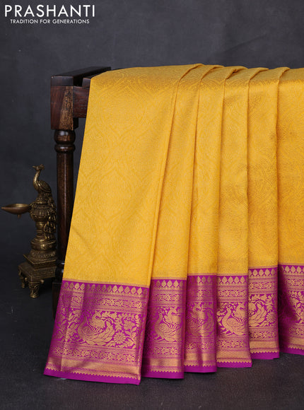 Kanchipuram silk saree yellow and purple with allover zari woven brocade weaves and zari woven border