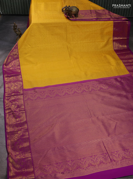 Kanchipuram silk saree yellow and purple with allover zari woven brocade weaves and zari woven border