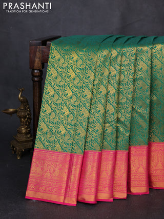 Kanchipuram silk saree green and pink with allover zari woven brocade weaves and zari woven border