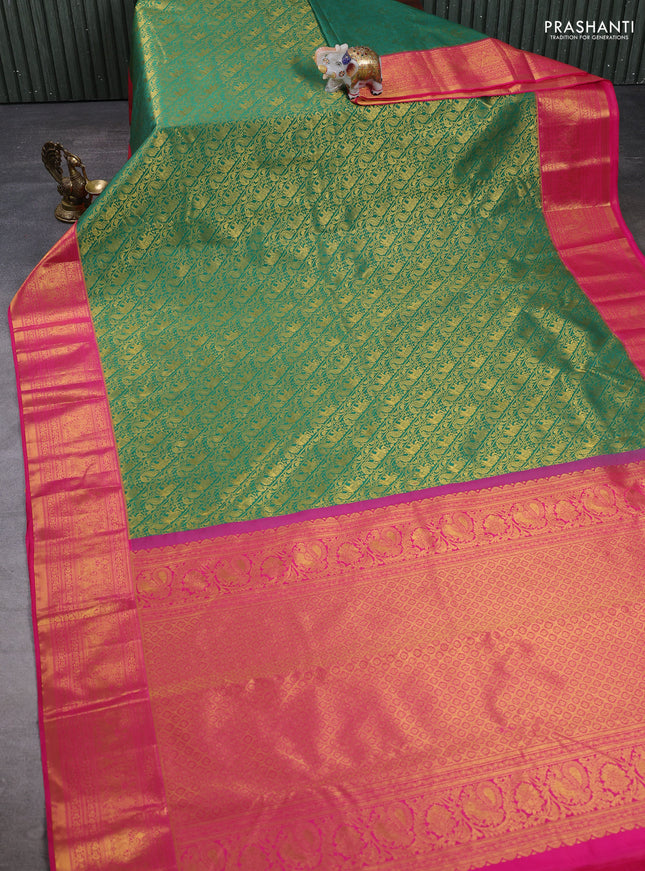 Kanchipuram silk saree green and pink with allover zari woven brocade weaves and zari woven border