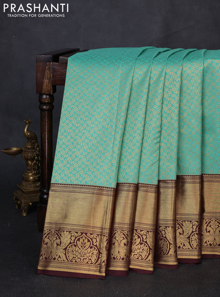 Kanchipuram silk saree teal green and coffee brown with allover zari woven brocade weaves and long rich zari woven border