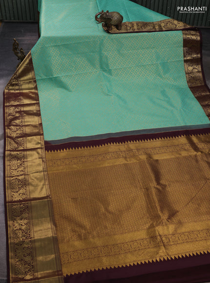 Kanchipuram silk saree teal green and coffee brown with allover zari woven brocade weaves and long rich zari woven border