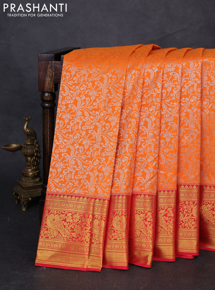 Kanchipuram silk saree orange and red with allover zari woven brocade weaves and zari woven border
