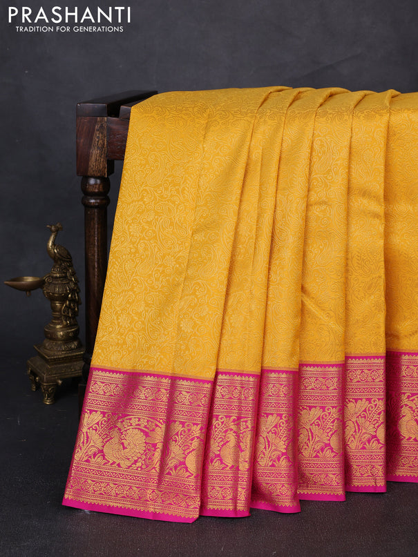 Kanchipuram silk saree yellow and pink with allover zari woven brocade weaves and zari woven border
