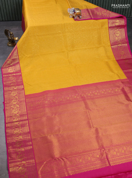 Kanchipuram silk saree yellow and pink with allover zari woven brocade weaves and zari woven border