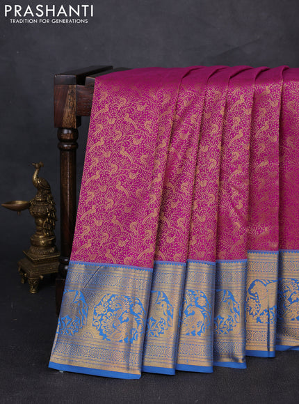 Kanchipuram silk saree magenta pink and blue with allover zari woven brocade weaves and zari woven border