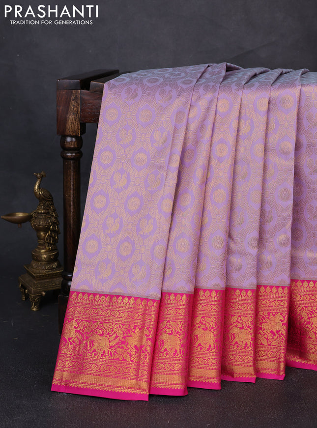 Kanchipuram silk saree lavender and pink with allover zari woven brocade weaves and zari woven border