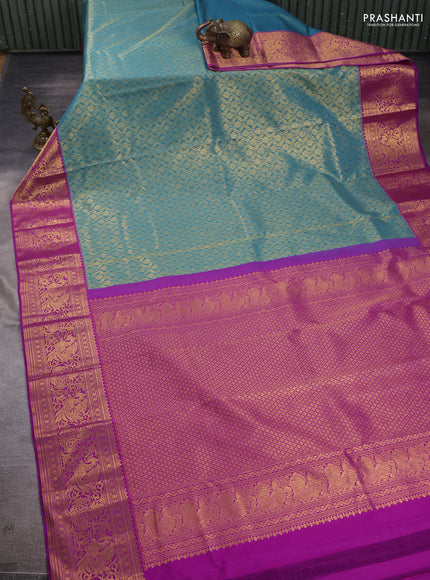 Kanchipuram silk saree teal blue and purple with allover zari woven brocade weaves and zari woven border