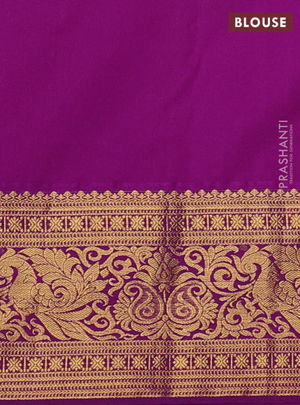 Kanchipuram silk saree teal blue and purple with allover zari woven brocade weaves and zari woven border